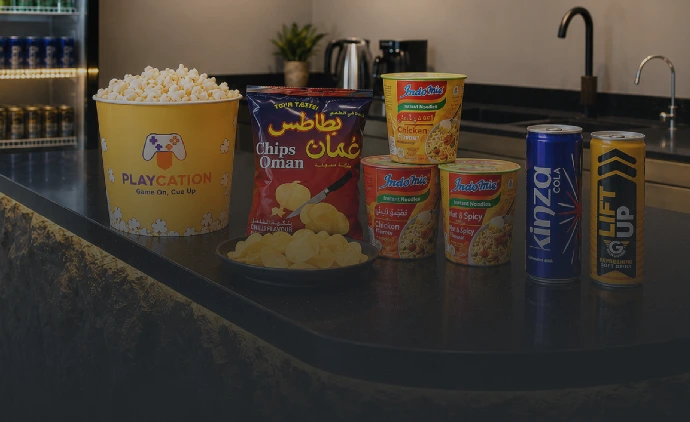 Drinks, snacks, popcorn, and chips available at the Playcation bar.