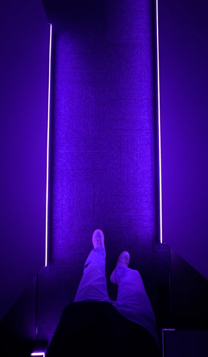 Purple ambient lighting inside a private entertainment room at Playcation.
